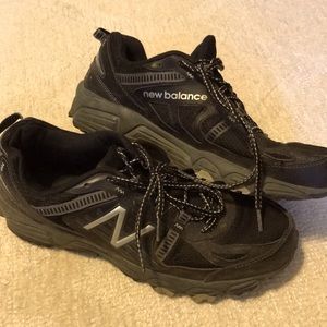 All-black New Balance sneakers